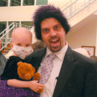 Father holding cancer-stricken child